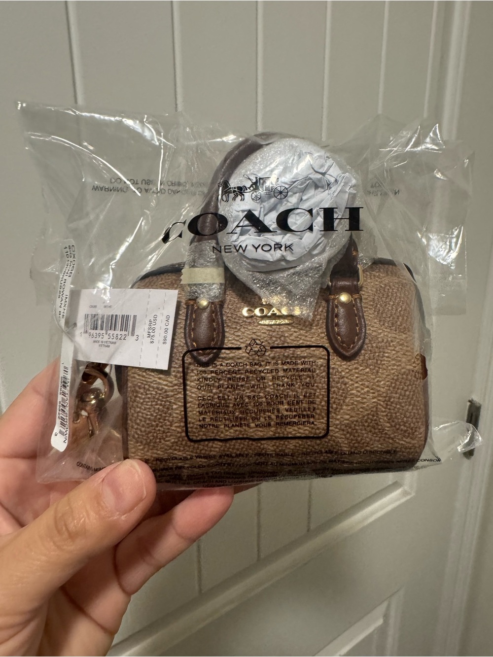 NET COACH Mini Satchel Keychain in signature print.